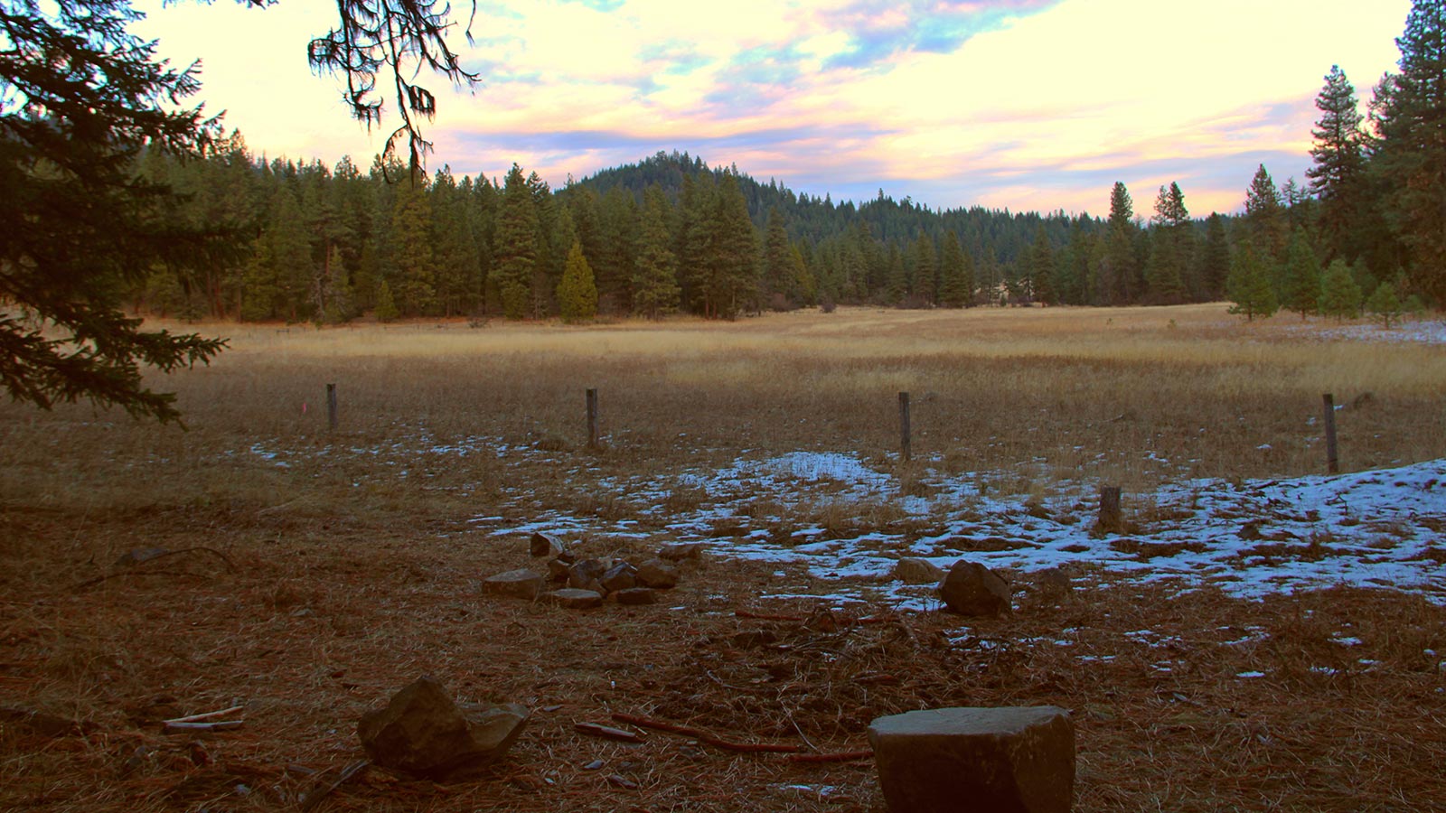 first snow on green burial site